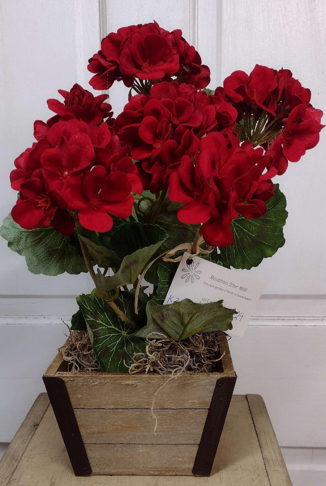 K385 - Arrangement with Red Geraniums