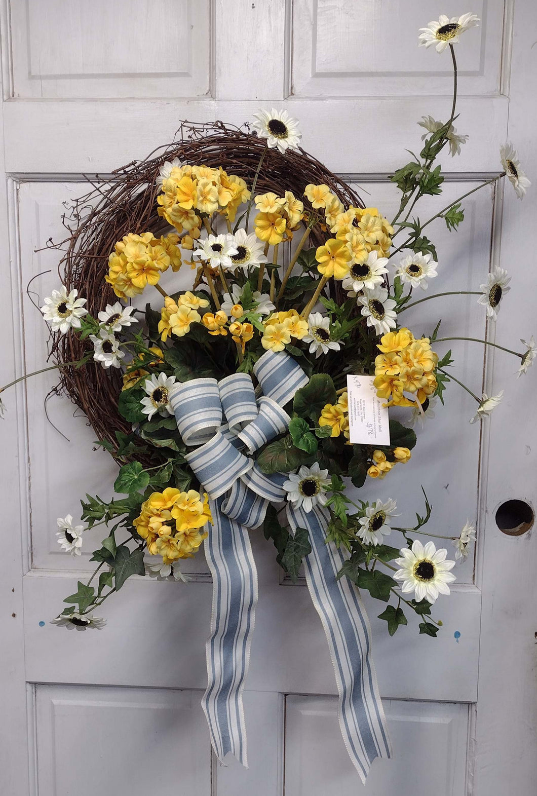 K478 - Wreath with Yellow Geraniums & White Susans