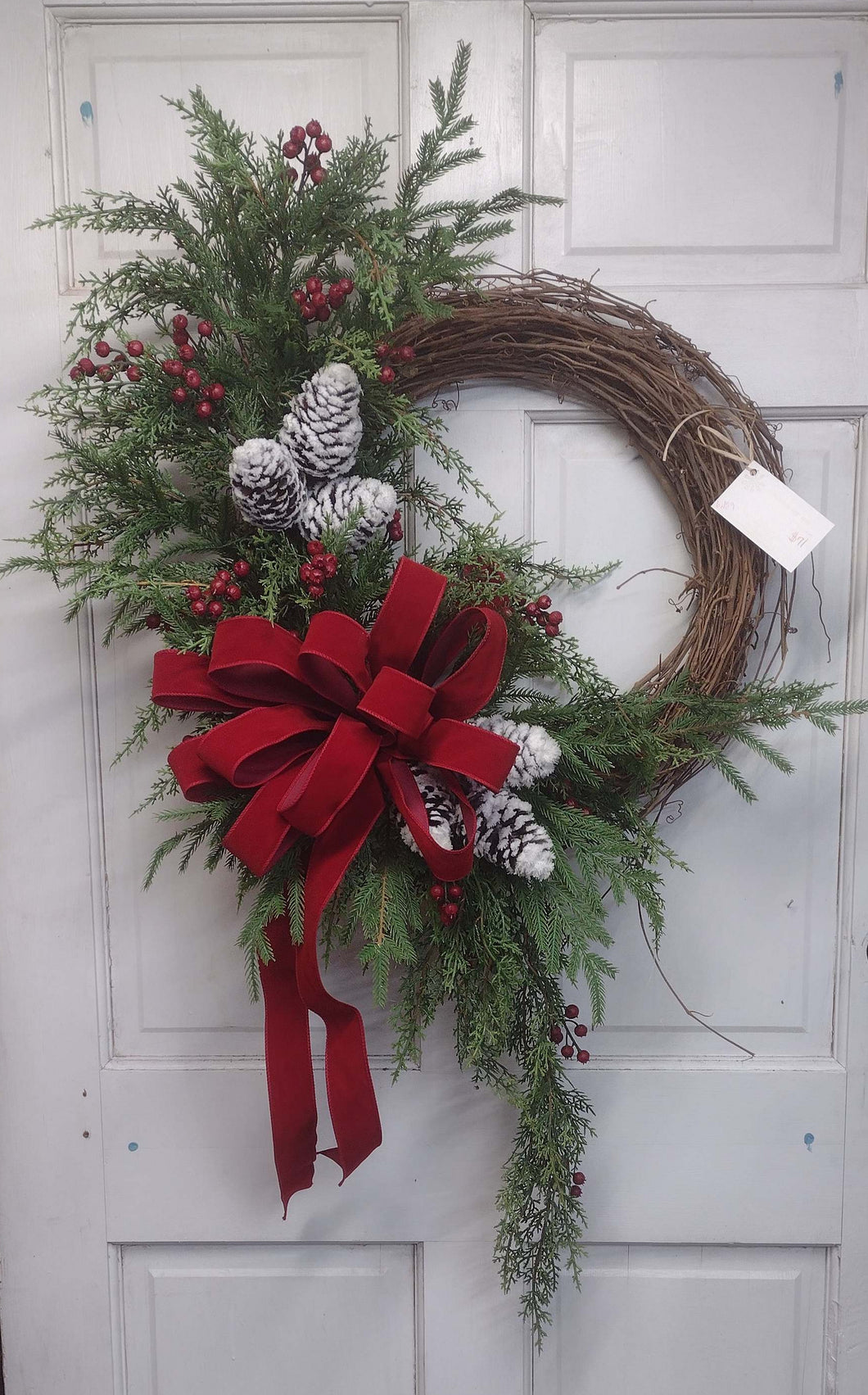 W129 - Winter Grapevine Wreath with Flowing Greenery & Huge Red Bow